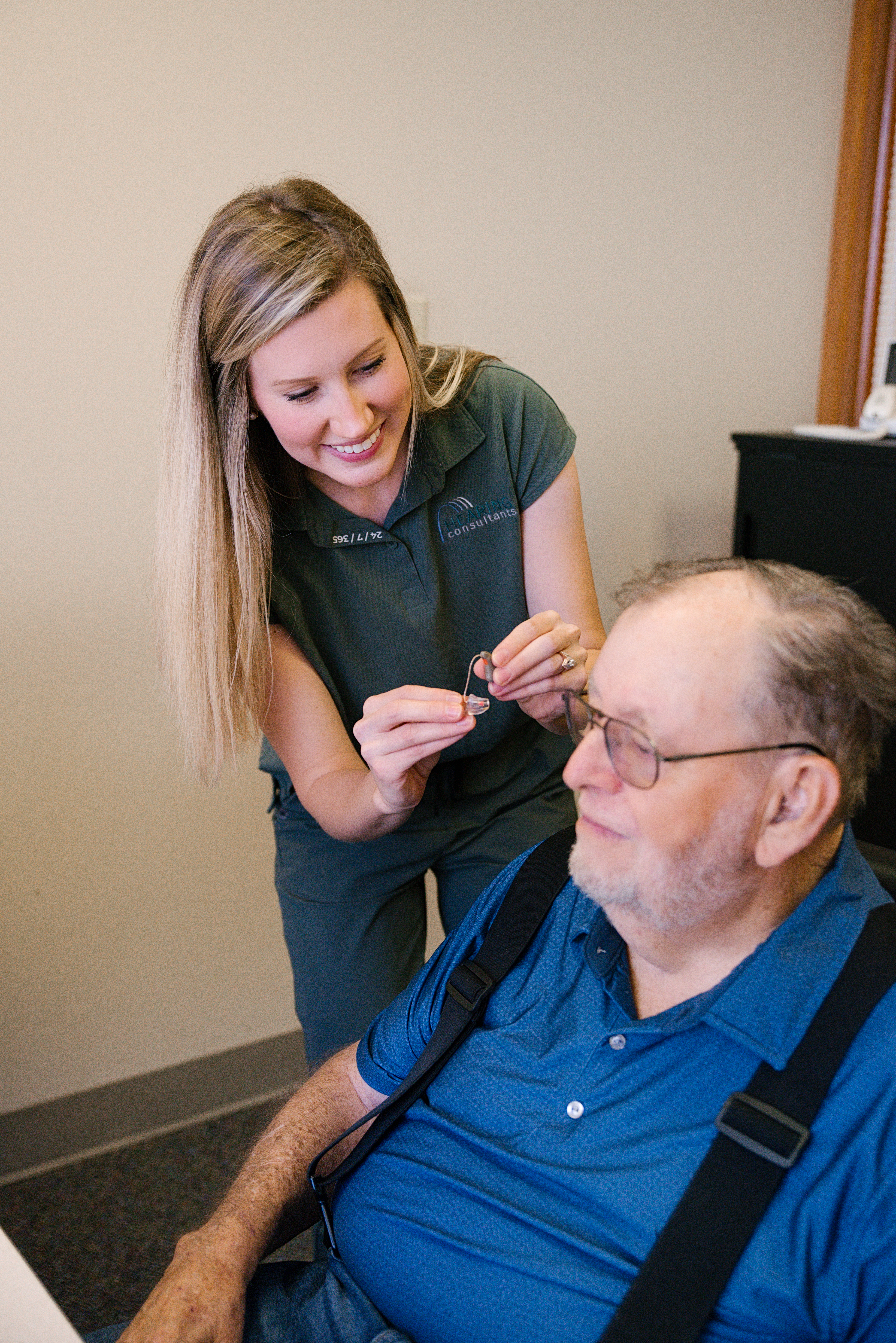 An older gentleman receving a hearing aid fitting at Hearing Consultants