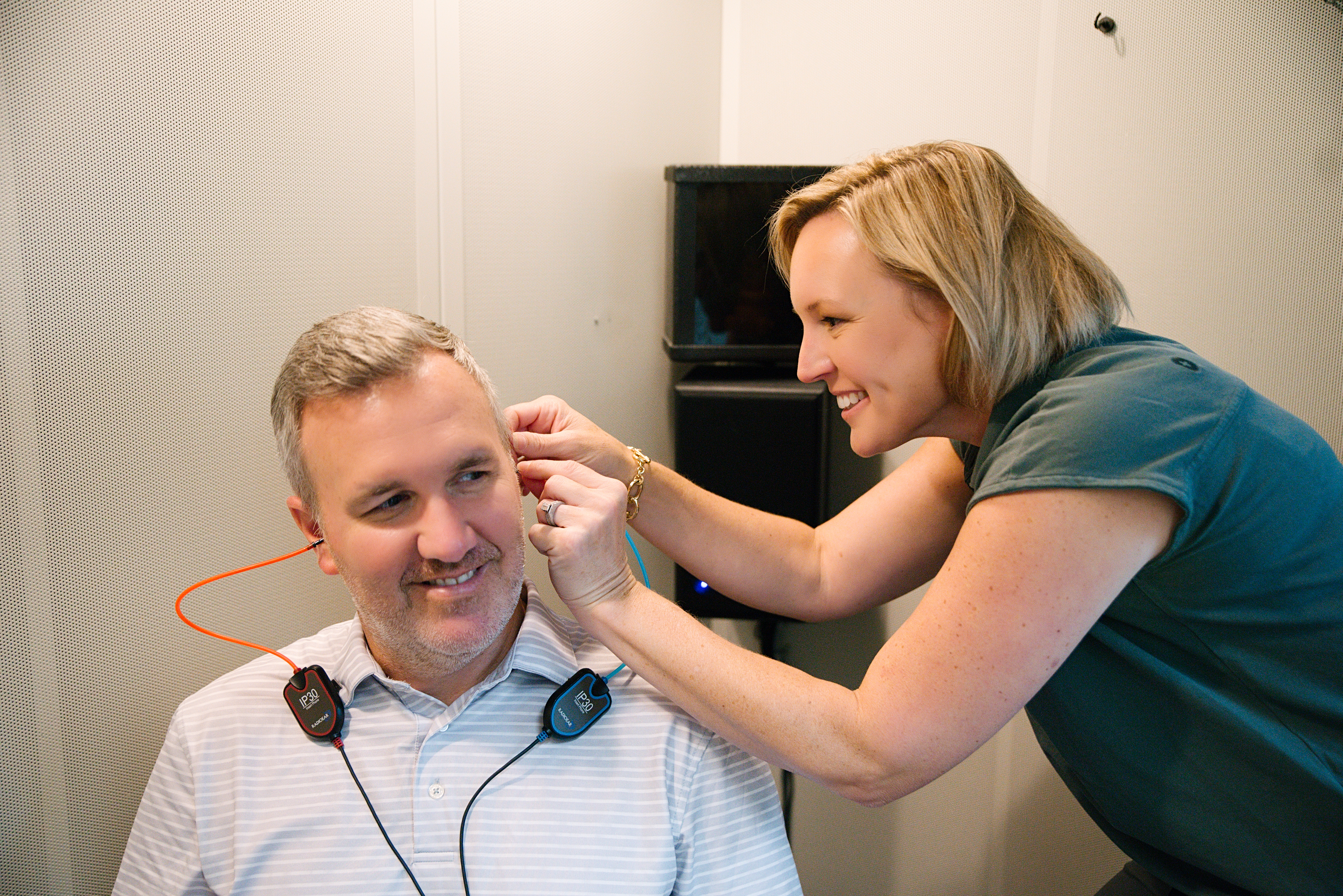 A man receiving a hearing aid fitting at Hearing Consultants