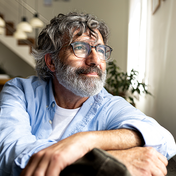 Man reflecting at home